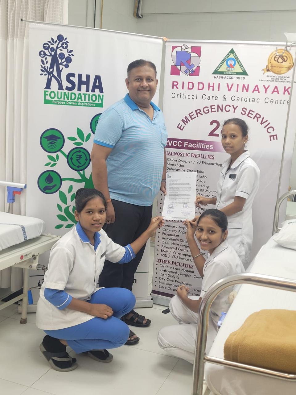 Healthcare Team with Asha Foundation Banner